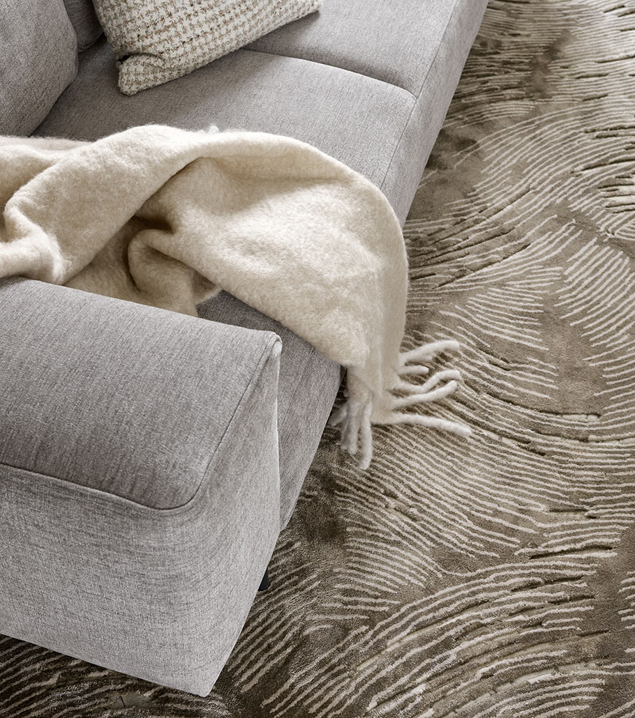 sillon sofa gris tapizado tela boconcept alfombra sala